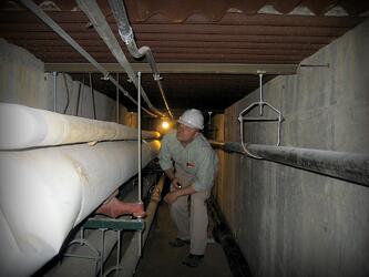 A Cx Associates commissioning agent inspects piping.