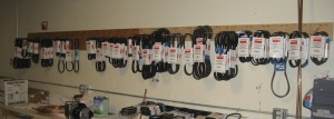A wall with 30 different types of belts
