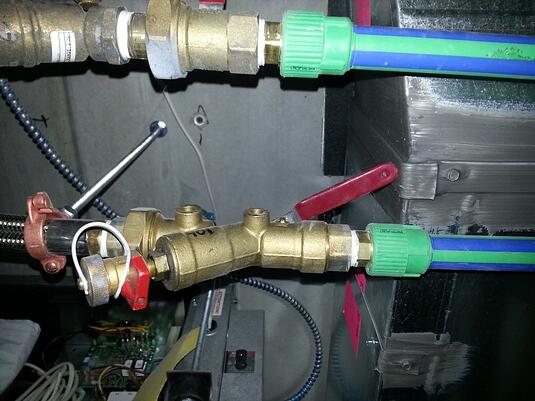 Figure 4: A heat pump isolation valve is blocked by ductwork and can't be fully opened.