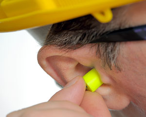 Man_inserting_earplugs.jpg